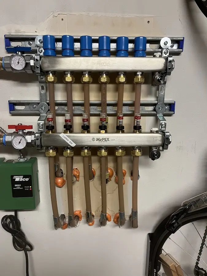 Plumber performing Water Heater Repair at a residential property in Desloge